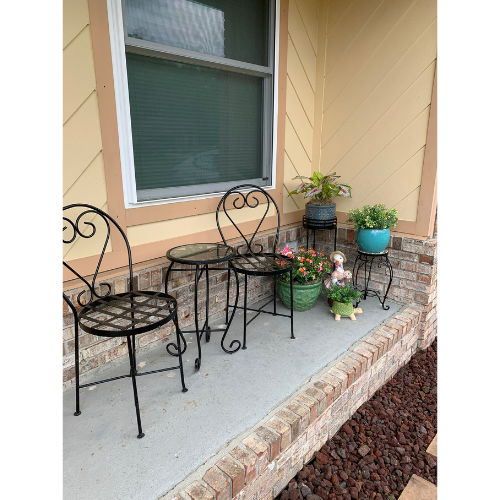 Bistro Set with decorative plants on the side