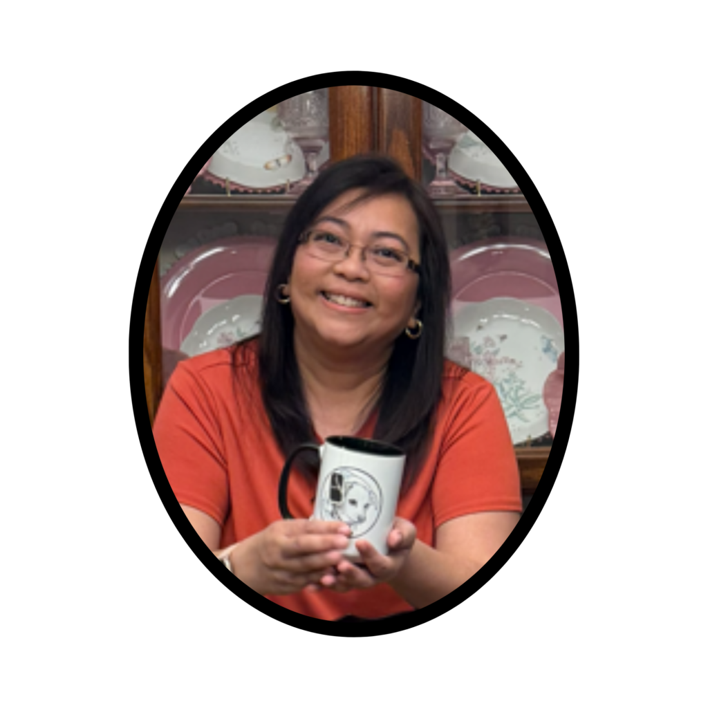 The Tea Gatherer holding a tea cup