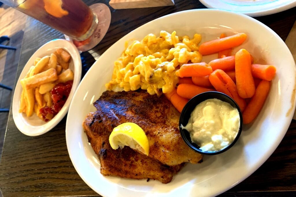Grilled Fish, Mac & Cheese, Carrots and Fries on the side.
